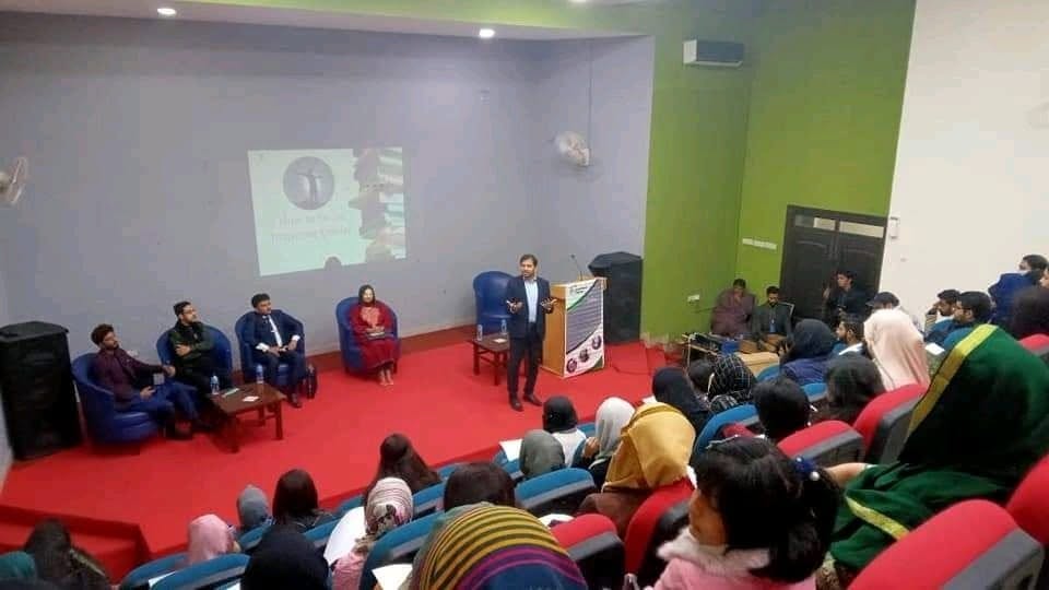University presentation and panel discussion in a lecture hall