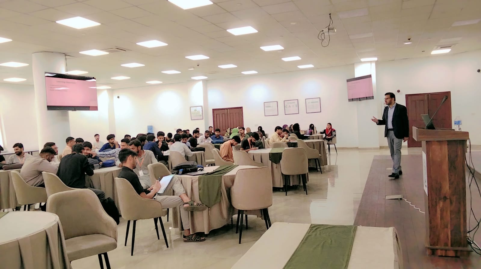 Founder-led professional training session in a presentation room